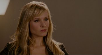 Movie still from “Forgetting Sarah Marshall” (2008), directed by Nicholas Stoller – A woman with long blonde hair wearing a black jacket; Close Up shot, Over the shoulder angle