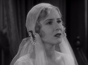 Movie still from “Frankenstein” (1931), directed by James Whale – A black and white photo of a woman wearing a veil; Close Up shot, Low angle