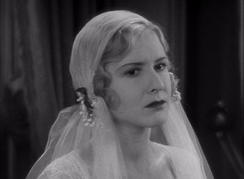 Movie still from “Frankenstein” (1931), directed by James Whale – A black and white photo of a woman wearing a veil; Close Up shot, Over the shoulder angle