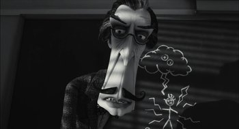 Movie still from “Frankenweenie” (2012), directed by Tim Burton – A black and white photo of a man with a mustache; Medium shot, Low angle