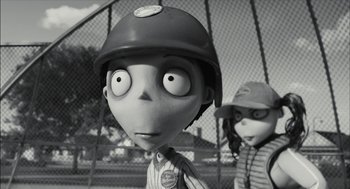 Movie still from “Frankenweenie” (2012), directed by Tim Burton – A black - and - white photo of a boy and a girl; Close Up shot, Over the shoulder angle