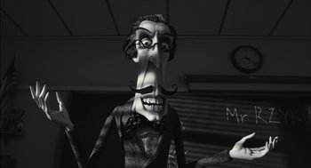 Movie still from “Frankenweenie” (2012), directed by Tim Burton – A man with a mustache wearing glasses and a bow tie; Close Up shot, Low angle