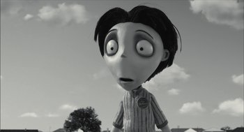 Movie still from “Frankenweenie” (2012), directed by Tim Burton – A black - and - white image of a cartoon character; Close Up shot, Over the shoulder angle