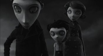 Movie still from “Frankenweenie” (2012), directed by Tim Burton – A black and white photo of a couple of people; Medium shot, Over the shoulder angle