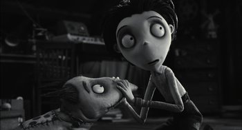 Movie still from “Frankenweenie” (2012), directed by Tim Burton – A black and white photo of a couple of people; Medium shot, High angle