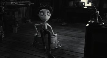 Movie still from “Frankenweenie” (2012), directed by Tim Burton – A black - and - white photo of a person sitting on a pot; Wide shot, High angle
