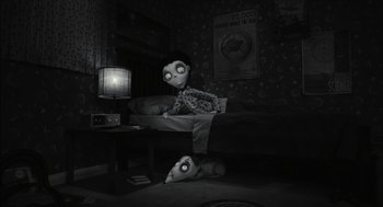 Movie still from “Frankenweenie” (2012), directed by Tim Burton – An image of a creepy doll in a dark room; Wide shot, High angle