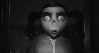 Movie still from “Frankenweenie” (2012), directed by Tim Burton – A black - and - white photo of a doll with two eyes; Close Up shot, Low angle