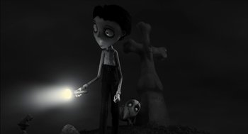 Movie still from “Frankenweenie” (2012), directed by Tim Burton – A cartoon of a boy holding a light in front of a cross; Medium shot, Low angle