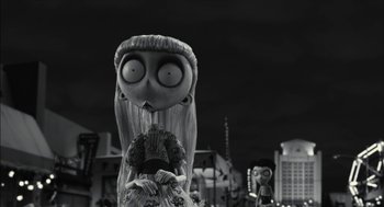 Movie still from “Frankenweenie” (2012), directed by Tim Burton – A black - and - white photo of a woman and a doll; Medium shot, Low angle