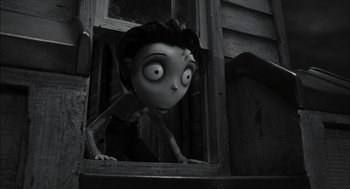 Movie still from “Frankenweenie” (2012), directed by Tim Burton – A black - and - white photo of a person looking out a window; Medium shot, High angle