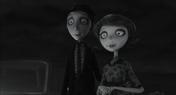 Movie still from “Frankenweenie” (2012), directed by Tim Burton – A black and white image of a couple of people; Medium shot, High angle