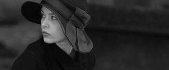 Movie still from “Frantz” (2016), directed by François Ozon – A woman wearing a hat with a bow around her head; Close Up shot, Low angle