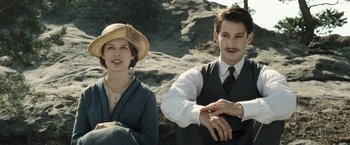 Movie still from “Frantz” (2016), directed by François Ozon – A man and a woman sitting next to each other on top of a hill; Medium shot, Low angle