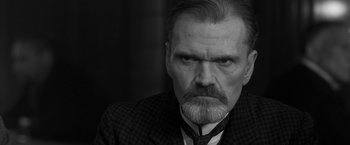 Movie still from “Frantz” (2016), directed by François Ozon – An old man with a beard and a mustache; Close Up shot, Low angle