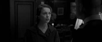 Movie still from “Frantz” (2016), directed by François Ozon – A black and white photo of a woman looking at the camera; Close Up shot, Over the shoulder angle