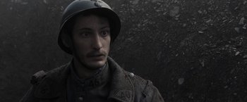 Movie still from “Frantz” (2016), directed by François Ozon – A man wearing a helmet and a jacket; Close Up shot, High angle