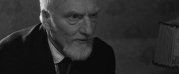 Movie still from “Frantz” (2016), directed by François Ozon – An old man with a beard and a mustache; Close Up shot, High angle