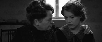 Movie still from “Frantz” (2016), directed by François Ozon – An older woman and a younger woman looking at one another; Close Up shot, Over the shoulder angle