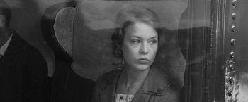 Movie still from “Frantz” (2016), directed by François Ozon – A black - and - white photo of a woman in a suit; Close Up shot, Low angle