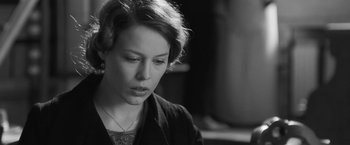 Movie still from “Frantz” (2016), directed by François Ozon – A woman with short blonde hair is looking down; Close Up shot, Over the shoulder angle