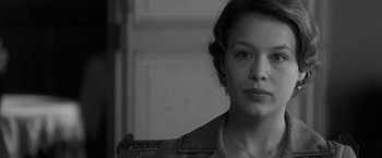 Movie still from “Frantz” (2016), directed by François Ozon – Black and white photograph of a woman in military attire; Close Up shot, Over the shoulder angle