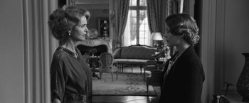 Movie still from “Frantz” (2016), directed by François Ozon – Two people in a living room talking to each other; Medium shot, Over the shoulder angle