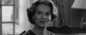 Movie still from “Frantz” (2016), directed by François Ozon – An older woman wearing a dress and earrings; Close Up shot, Over the shoulder angle