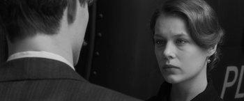 Movie still from “Frantz” (2016), directed by François Ozon – A man and a woman looking at one another in the mirror; Close Up shot, Over the shoulder angle