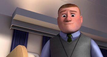 Movie still from “Free Birds” (2013), directed by Jimmy Hayward – An animated man in a vest and tie; Medium shot, Low angle