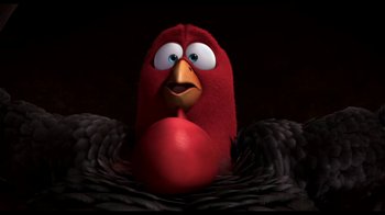 Movie still from “Free Birds” (2013), directed by Jimmy Hayward – A red bird with a big beak is sitting in the dark; Close Up shot, Low angle