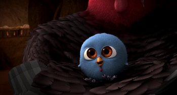 Movie still from “Free Birds” (2013), directed by Jimmy Hayward – A blue stuffed bird sitting on top of a pile of feathers; Extreme Close Up shot, High angle