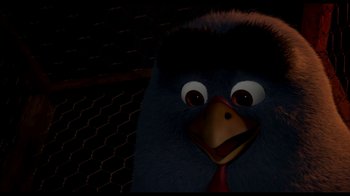 Movie still from “Free Birds” (2013), directed by Jimmy Hayward – The head of a bird with a red tie around it's neck; Extreme Close Up shot, High angle