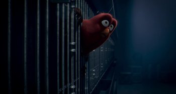 Movie still from “Free Birds” (2013), directed by Jimmy Hayward – A red stuffed animal hanging on a metal fence; Close Up shot, Low angle