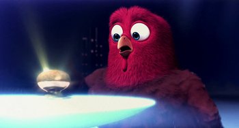 Movie still from “Free Birds” (2013), directed by Jimmy Hayward – A red bird is sitting in front of a table; Close Up shot, High angle