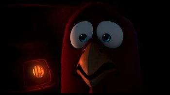 Movie still from “Free Birds” (2013), directed by Jimmy Hayward – A red bird with big blue eyes is looking at the camera; Close Up shot, High angle
