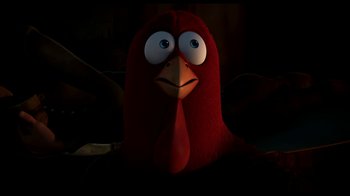 Movie still from “Free Birds” (2013), directed by Jimmy Hayward – A red stuffed bird with big blue eyes; Close Up shot, High angle