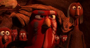 Movie still from “Free Birds” (2013), directed by Jimmy Hayward – A group of birds are standing in front of an angry bird; Close Up shot, Over the shoulder angle