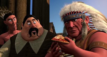 Movie still from “Free Birds” (2013), directed by Jimmy Hayward – Two animated characters one of them is holding a slice of pizza; Close Up shot, Over the shoulder angle