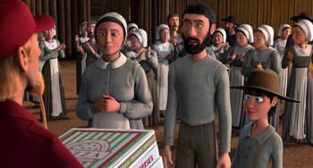 Movie still from “Free Birds” (2013), directed by Jimmy Hayward – An animated picture of a man and a woman standing in front of a box of pizza; Medium shot, Over the shoulder angle