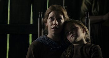 Movie still from “Free State of Jones” (2016), directed by Gary Ross – A woman and a girl are posing for a picture; Close Up shot, Low angle