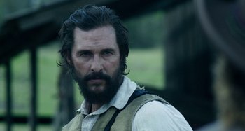 Movie still from “Free State of Jones” (2016), directed by Gary Ross – A person with a beard; Close Up shot, Over the shoulder angle
