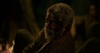 Movie still from “Free State of Jones” (2016), directed by Gary Ross – An old man with a beard and a mustache; Close Up shot, High angle