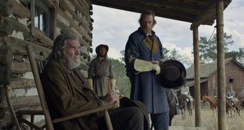Movie still from “Free State of Jones” (2016), directed by Gary Ross – A group of men standing next to each other on horses; Medium shot, Over the shoulder angle