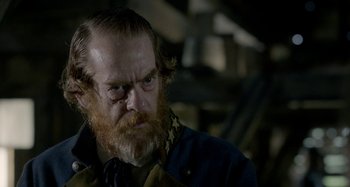 Movie still from “Free State of Jones” (2016), directed by Gary Ross – A person with a beard; Close Up shot, Over the shoulder angle