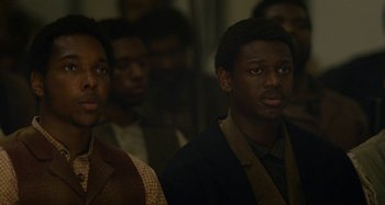 Movie still from “Free State of Jones” (2016), directed by Gary Ross – A group of men standing next to each other in a room; Close Up shot, Low angle