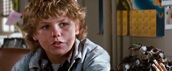 Movie still from “Free Willy” (1993), directed by Simon Wincer – A young boy sitting in front of a mirror; Close Up shot, Low angle