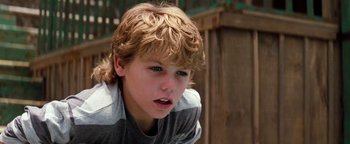 Movie still from “Free Willy” (1993), directed by Simon Wincer – A young boy is looking into the distance; Close Up shot, High angle
