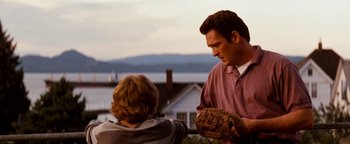 Movie still from “Free Willy” (1993), directed by Simon Wincer – A man and a boy are talking outside; Medium shot, Over the shoulder angle