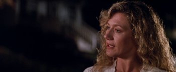 Movie still from “Free Willy” (1993), directed by Simon Wincer – A person with curly blonde hair; Close Up shot, Low angle
